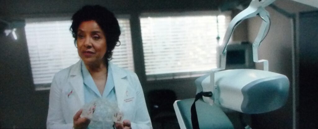Dr. Lillian Brooks (Phylicia Rashad) and her ground-breaking, but disturbing invention. (Image from Blumhouse's Black Box, 2020)